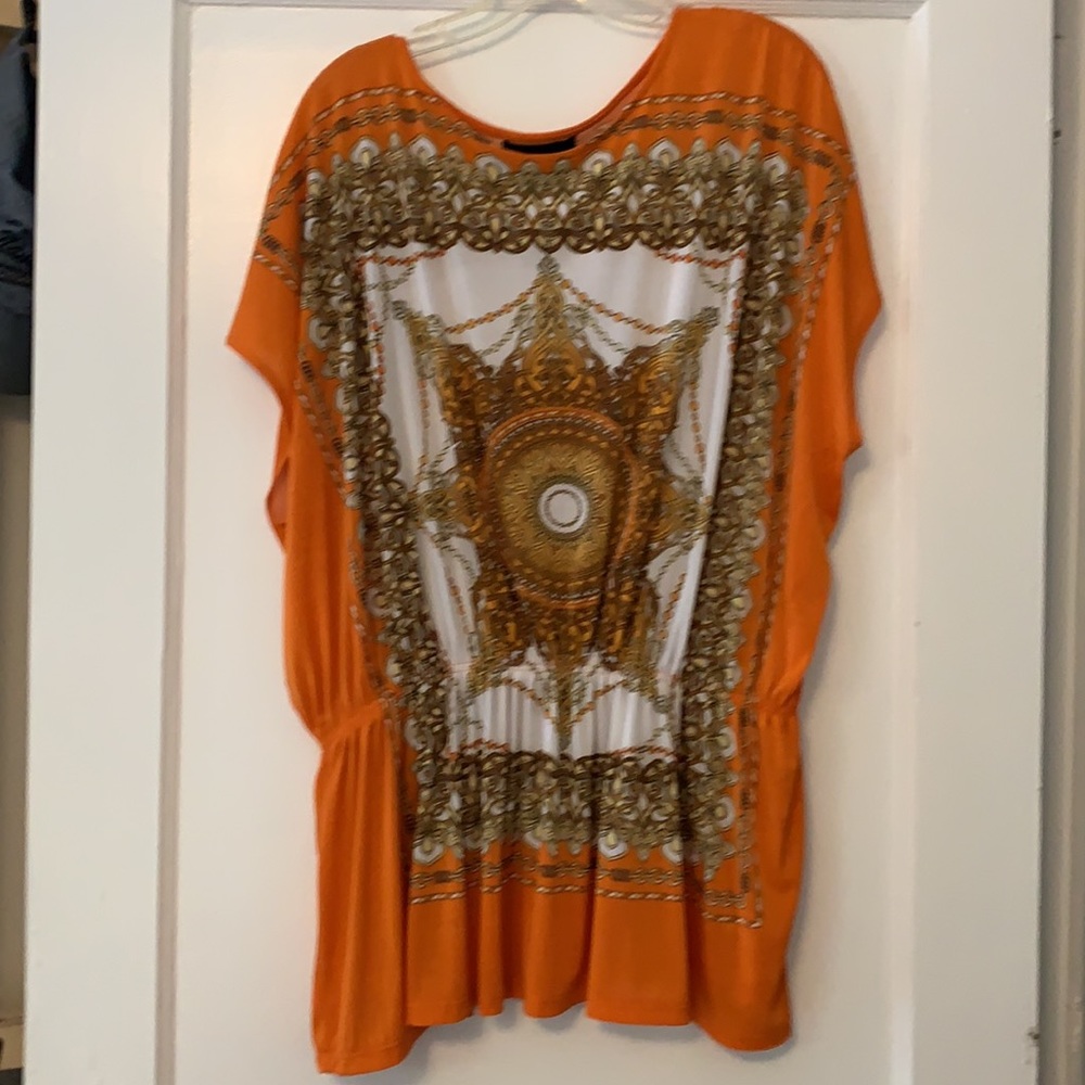 Isabella Rodriguez orange/tan top